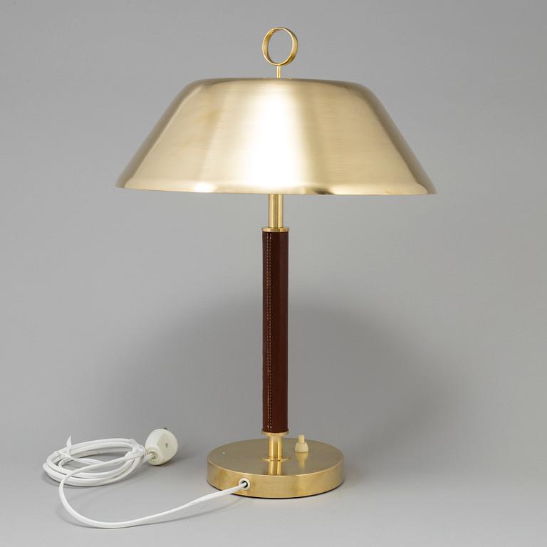 A brass and leather table light from Falkenbergs Belysning, second half of the 20th Century.