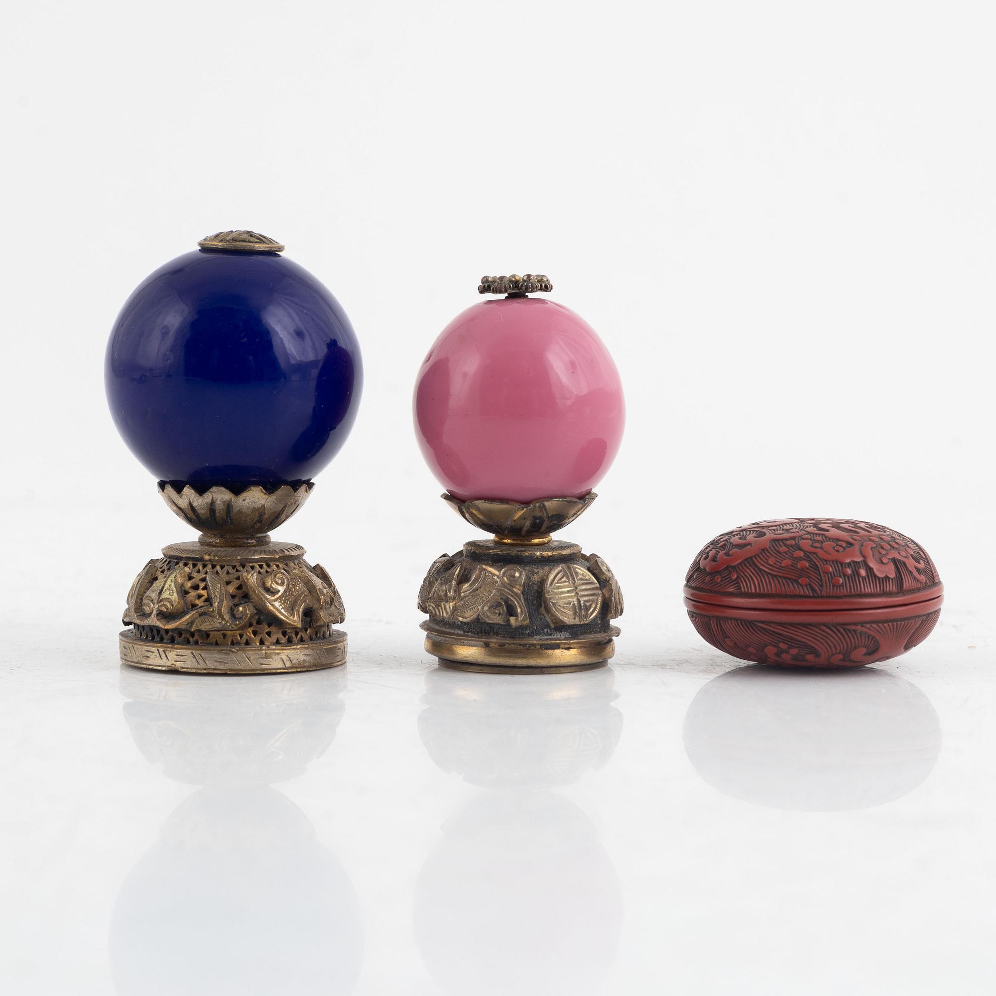 Two Chinese hat finials / mandarin insignias and a red lacquer box / button, late Qing dynasty.