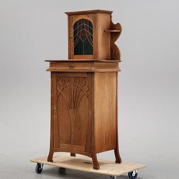 An oak art noveau cabinet, early 20th Century.