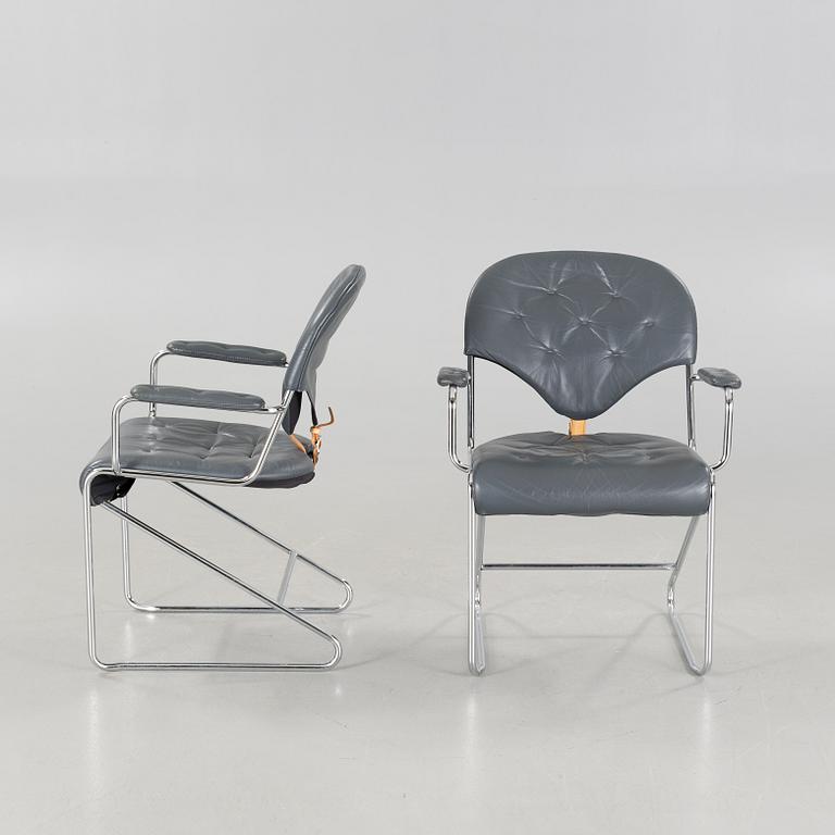 A pair of chairs by Sam Larsson for Dux, designed in 1974.