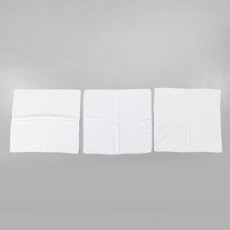 Three 19th century damask napkins.