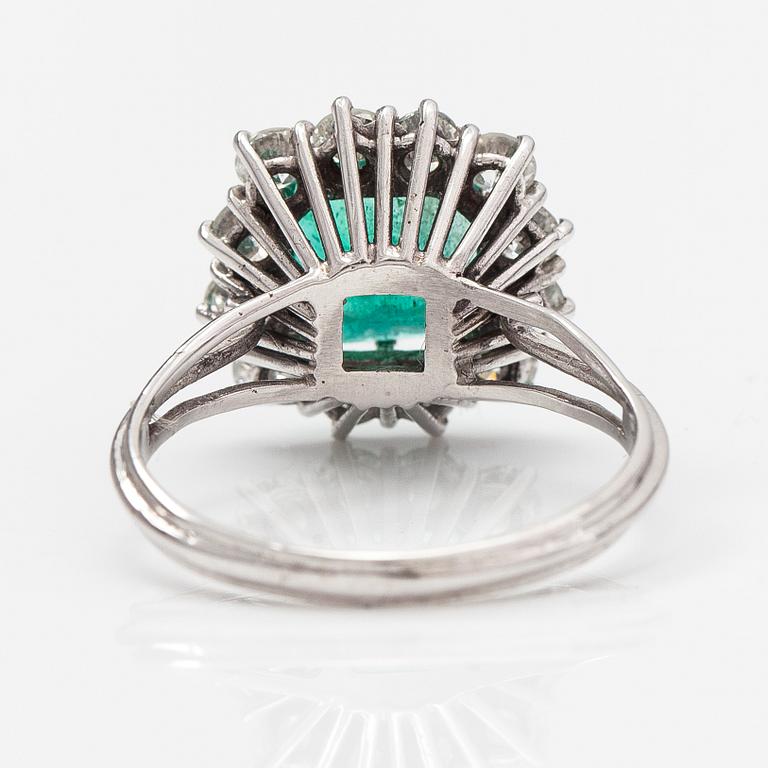 An 18K white gold ring with diamonds ca. 1.56 ct in total and an emerald ca. 2.70 ct according to certificate.