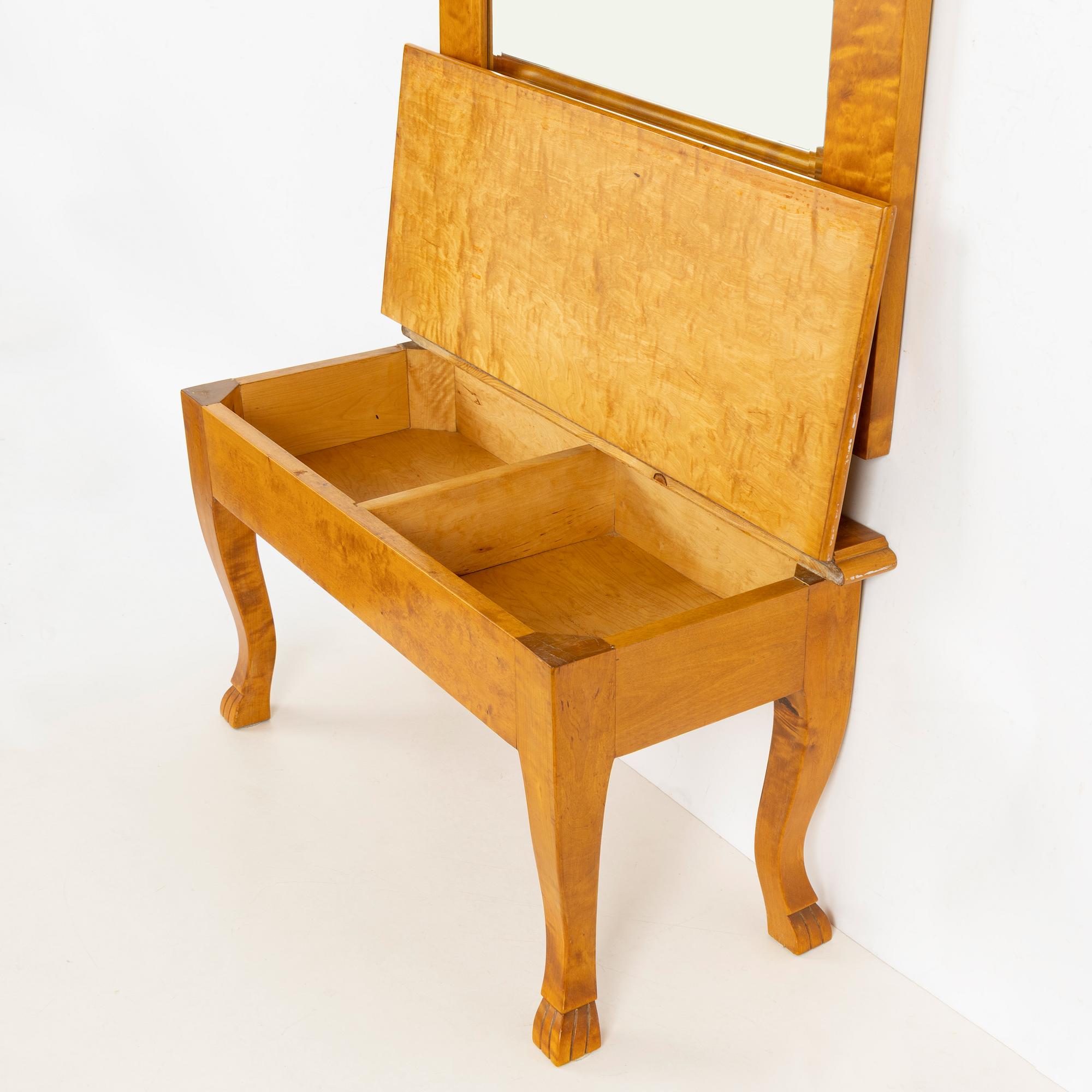 A mirror with console table, early 20th century.