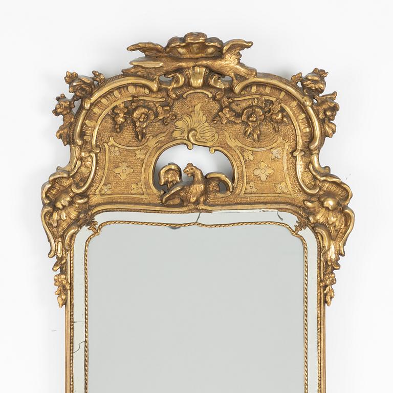 A giltwood rococo mirror, later part of the 18th century.