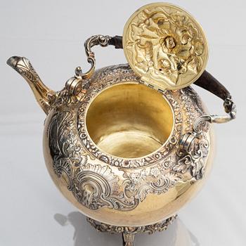 An English silver-gilt teapot with stand and burner, mark of Richard Sibley I, London 1825.