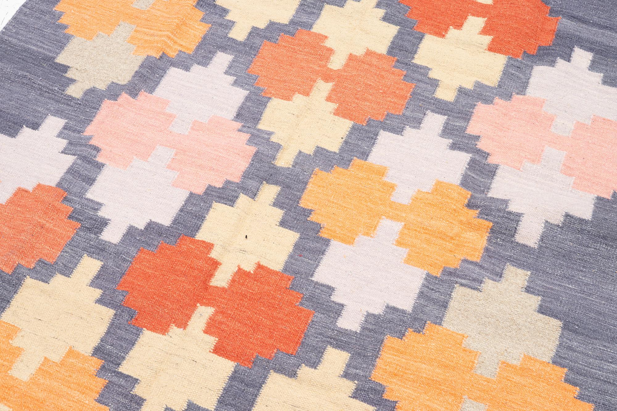 A flat weave carpet, ca 244 x 172 cm.