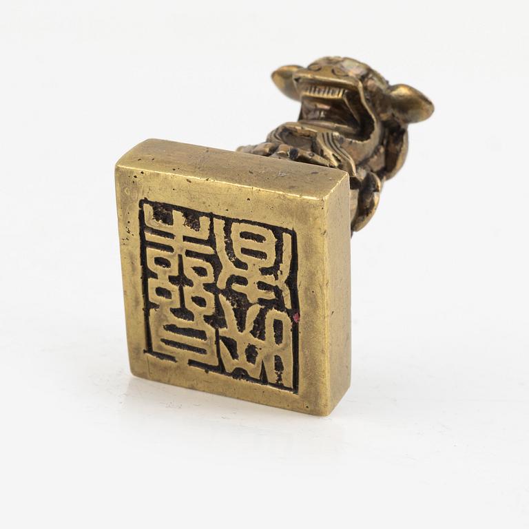 A Chinese bronze seal stamp and a tripod censer, late Qing dynasty, 19th century.