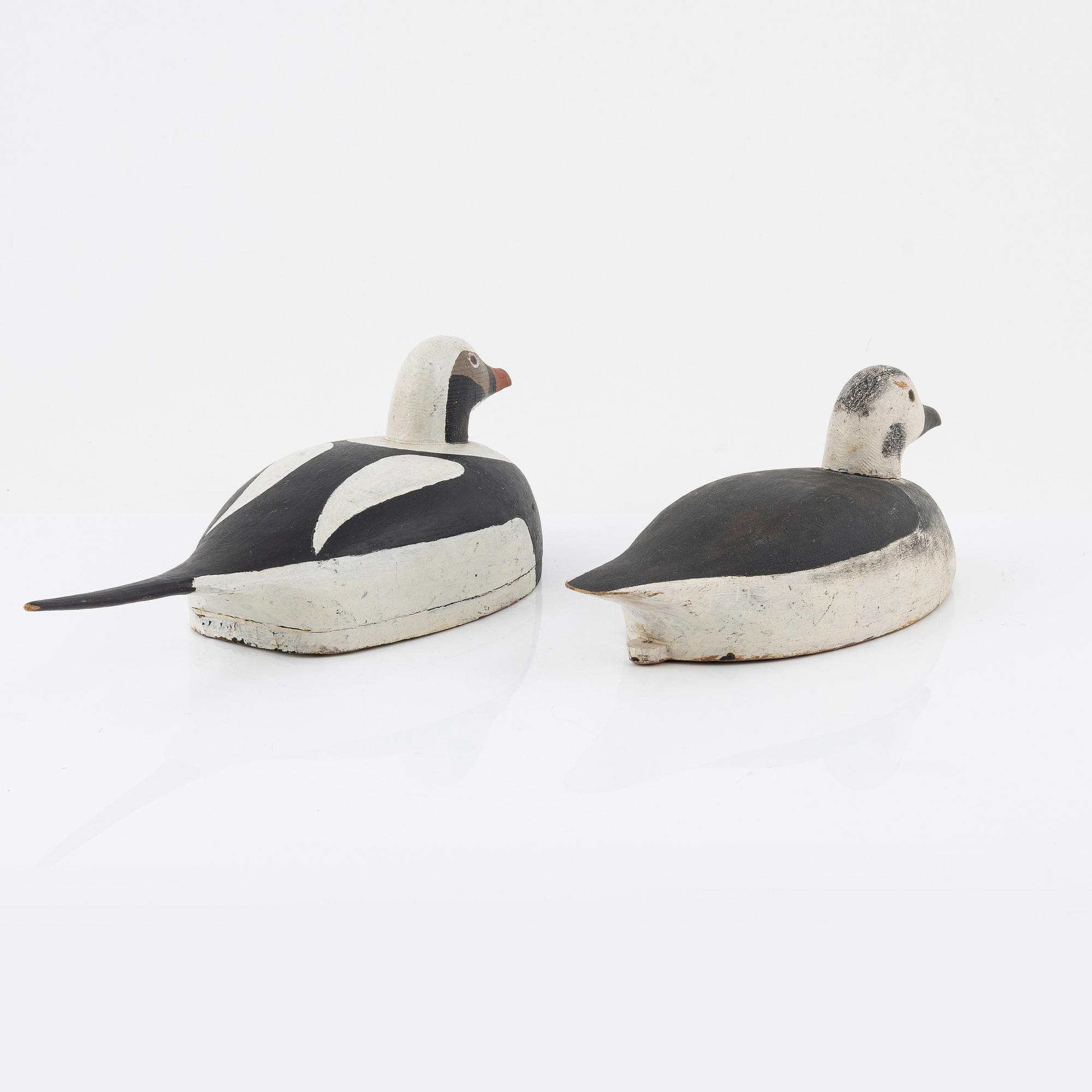 Two wooden decoy ducks, signed Eric Österman 1916.
