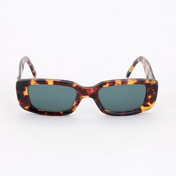 GUCCI, a apair of sunglasses.