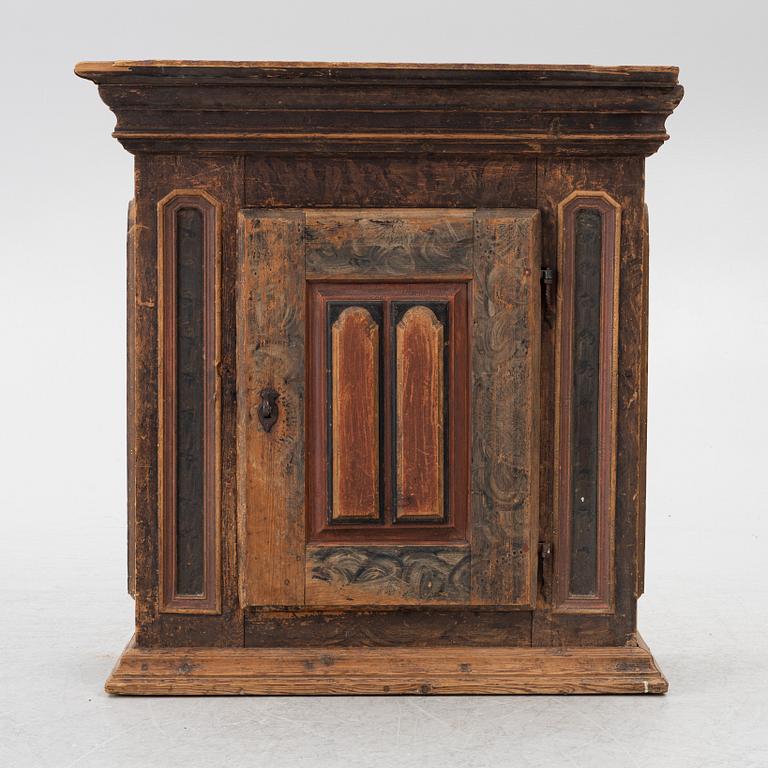 A polychrome-painted folk art hanging cabinet from Järvsö, Sweden, early 19th century.