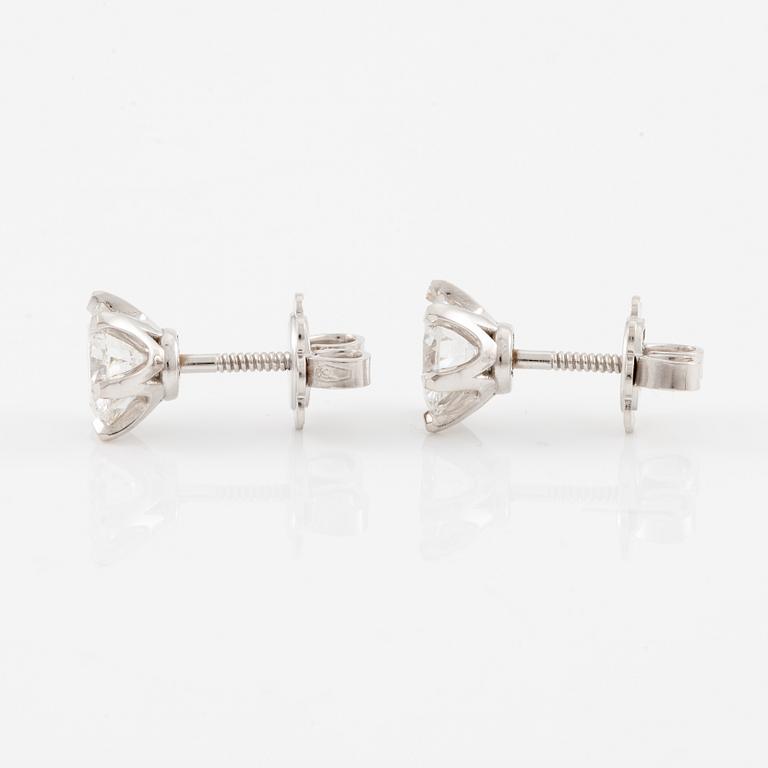 Brilliant-cut diamond stud earrings.
