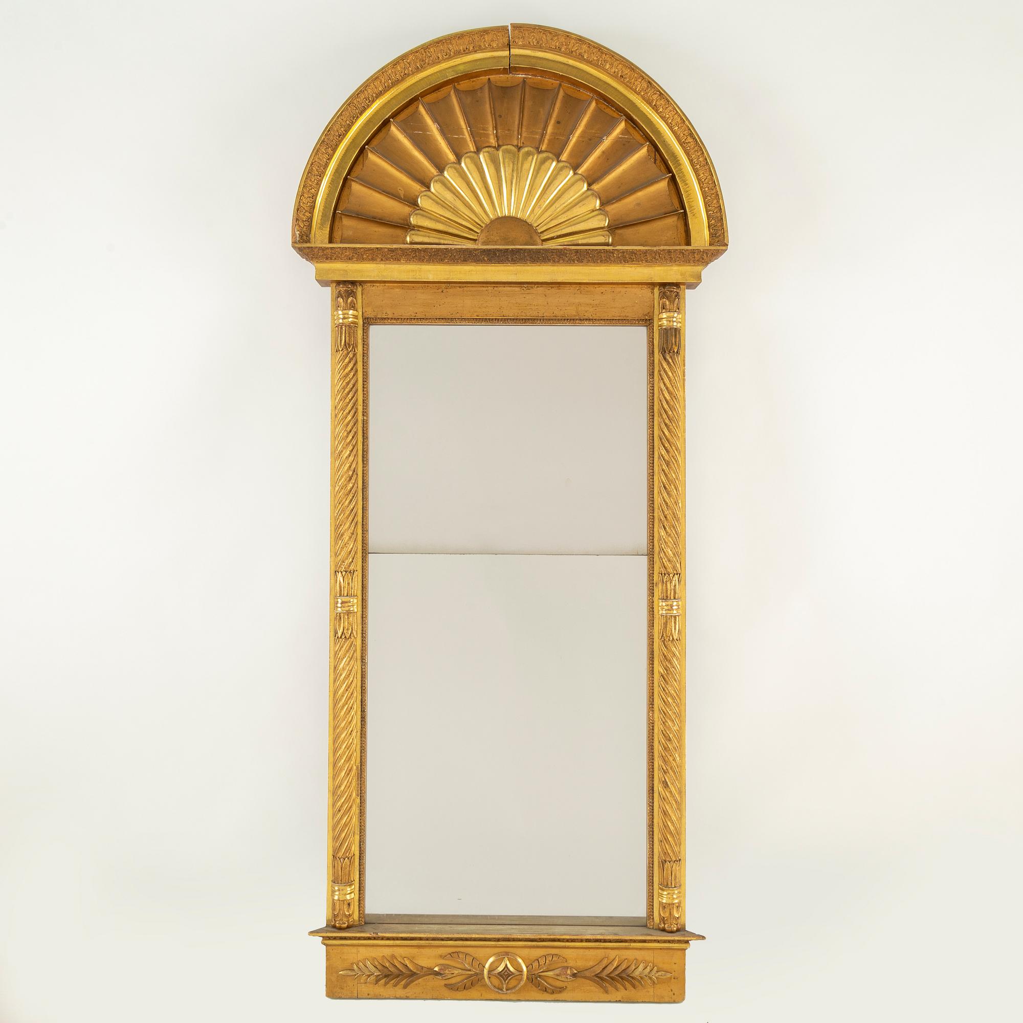 An Empire mirror from the first half of the 19th century.