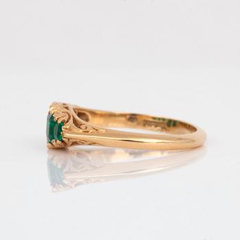 A ring with five step-cut emeralds.