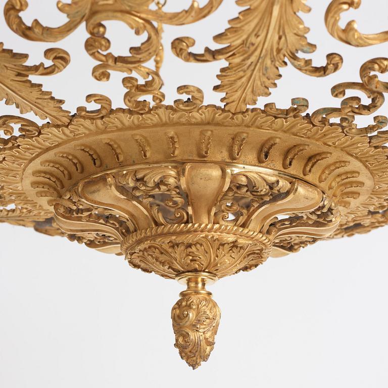 A rococo-revival gilt-brass sixteen-light chandelier, mid 19th century.