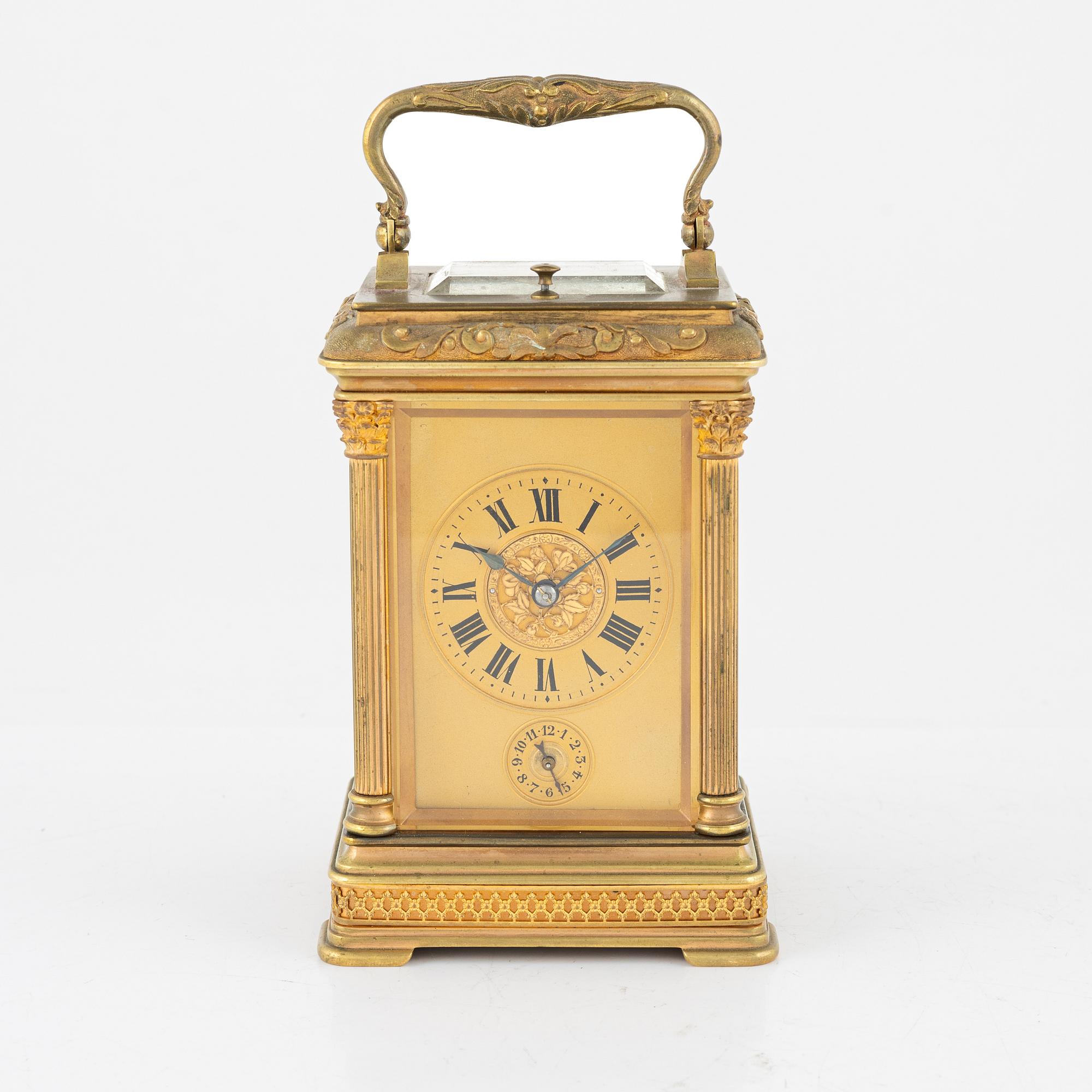 A French Brass and Glass Aiguilles Carriage Clock with Leather Case, first half of the 20th century.