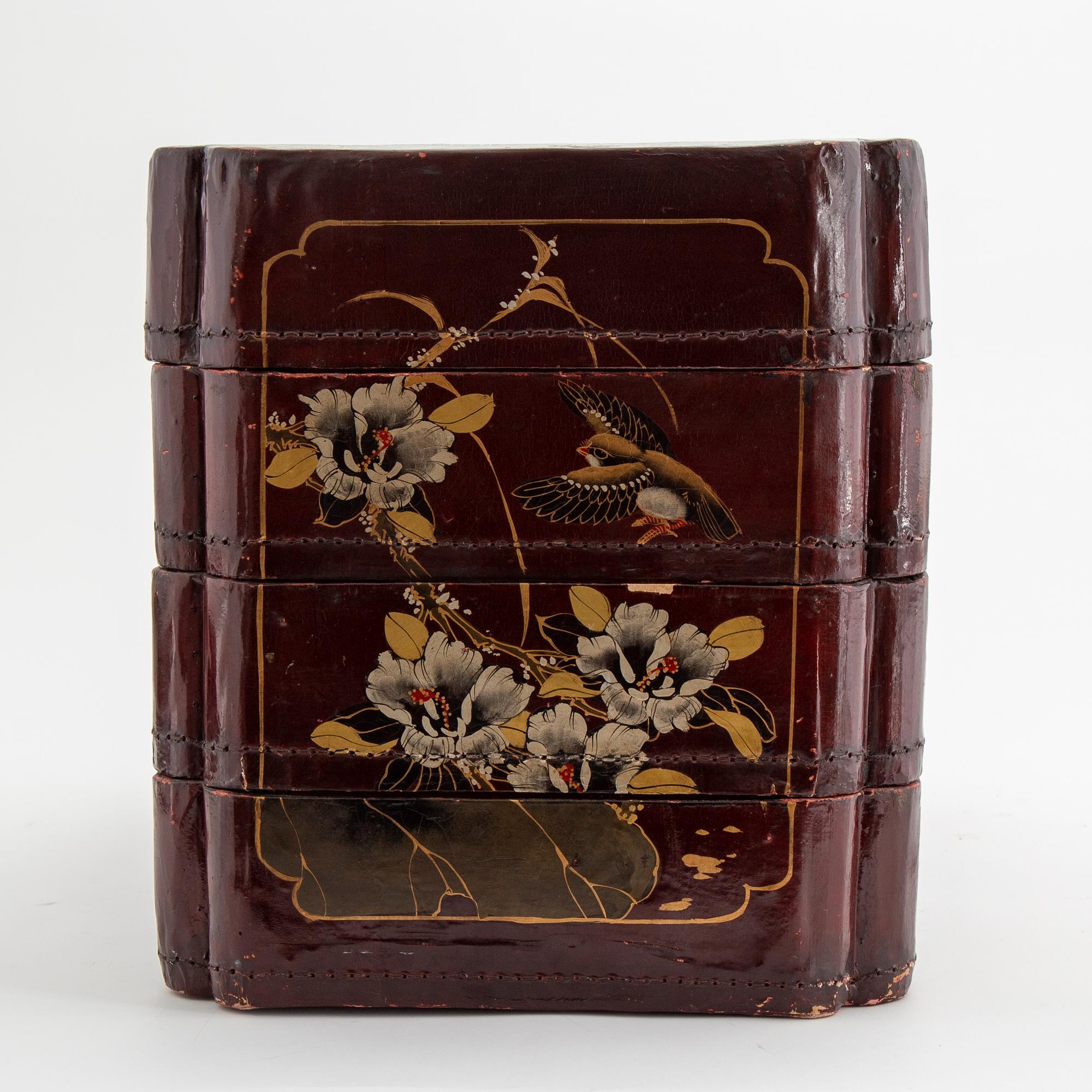 A painted Japanese four tiered box, 20th Century.