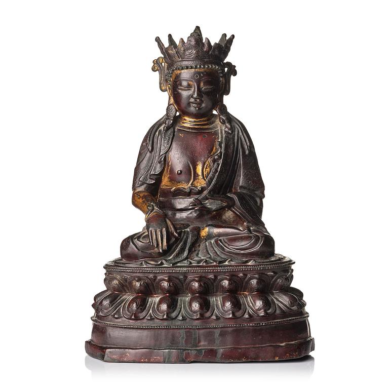 A bronze sculpture of a crowned Buddha, presumably late Ming dynasty, with an inscription dating it as 1530.