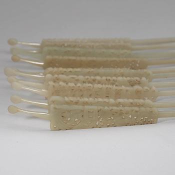 A set of ten carved pale celadon nephrite hairpins, late Qing dynasty (1644-1912).