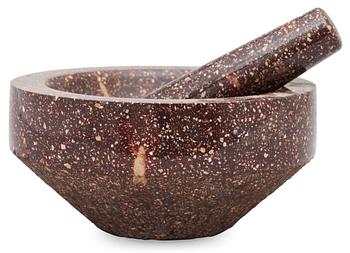 A Swedish porphyry mortar with pestel.