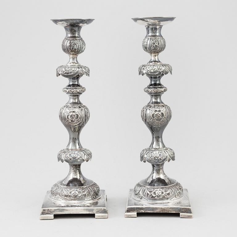 A pair of silver Sabbath candlesticks, Maker M. Sztern, Warsaw, Poland. Assayer Josef Sosnkowski, 1864. Weight 833 g.