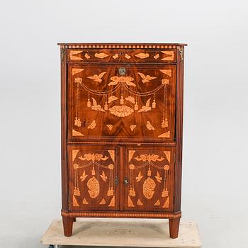 A Louis XV mahogany secretaire around 1800.