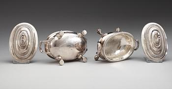 A pair of English 19th century silver sauce tureens, makers mark of Thomas Robins, London 1813-1814.