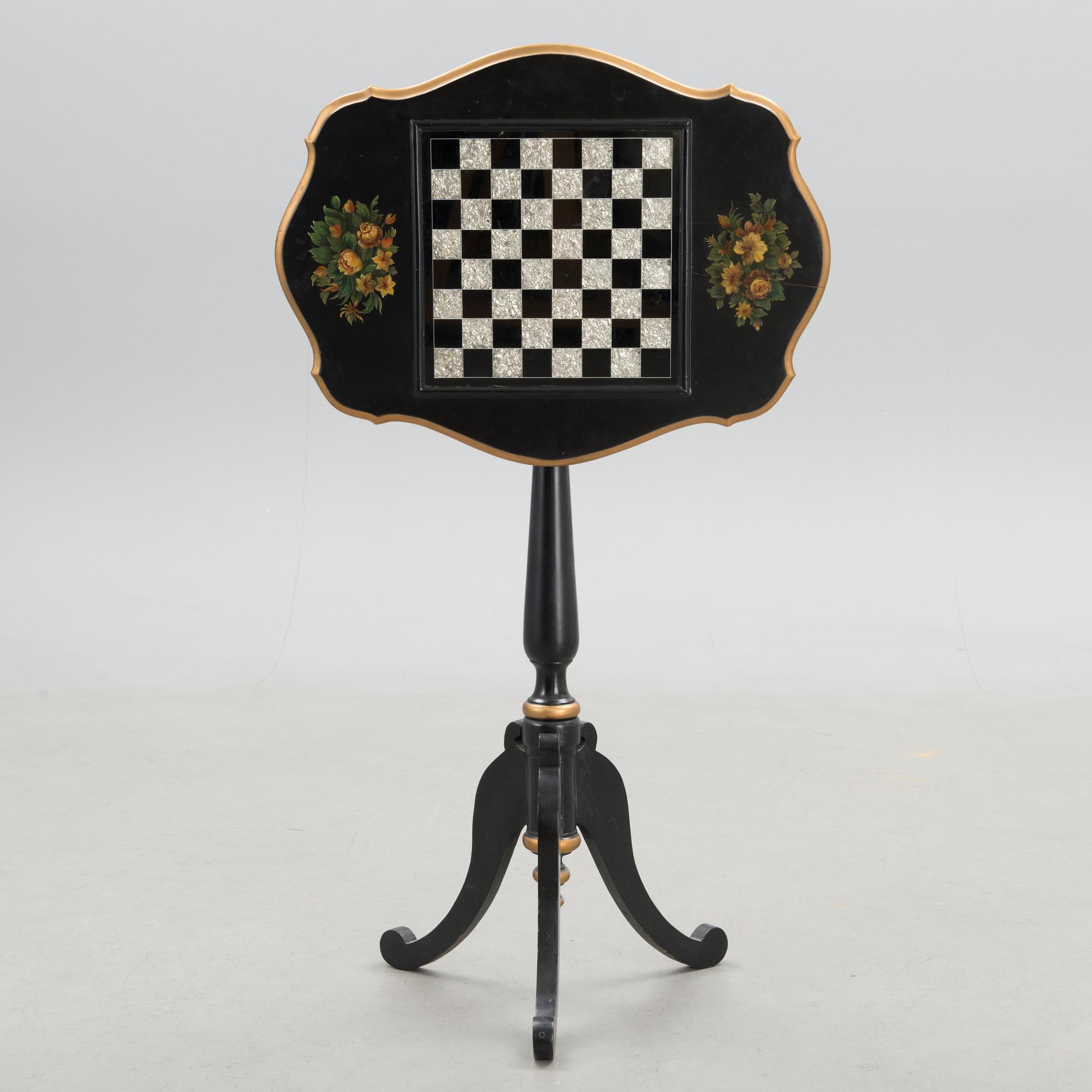 A Chinese tilt top chess table from the first half of the 20th century.