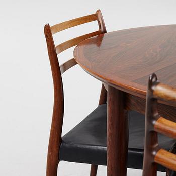 Niles Otto Møller, a rosewood veneered table with four chairs, JL Møller, Denmark, 1950's/60's.