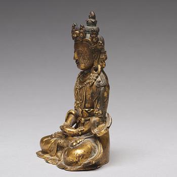 A gilt bronze figure of Amitayus buddha, Tibeto-Chinese, 18th Century.