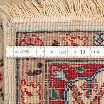 An oriental, figural rug, c. 230 x 145 cm.