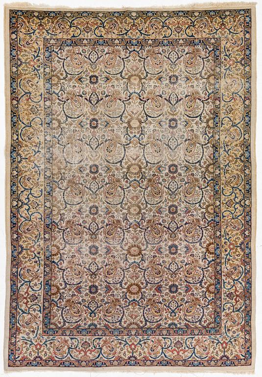 A Tabriz carpet, semi-antique, c. 330 x 230 cm.