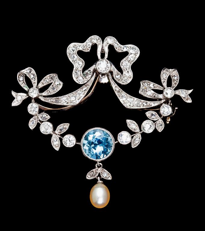 A platinum, diamond and aquamarine brooch, 1900.