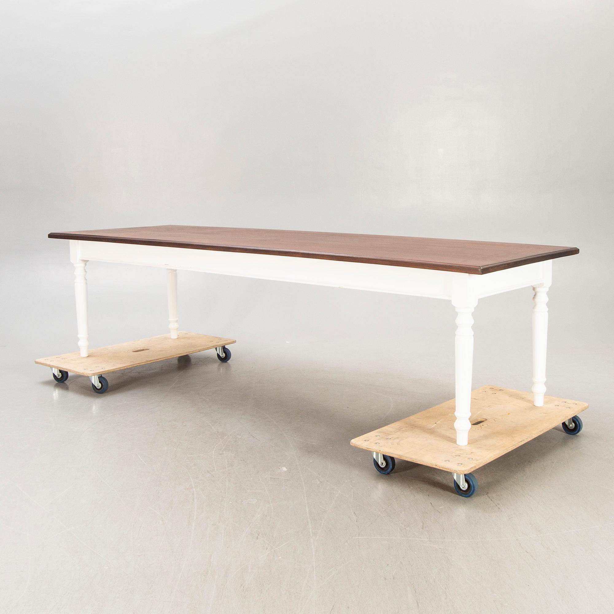 A painted and stained table 21st century.