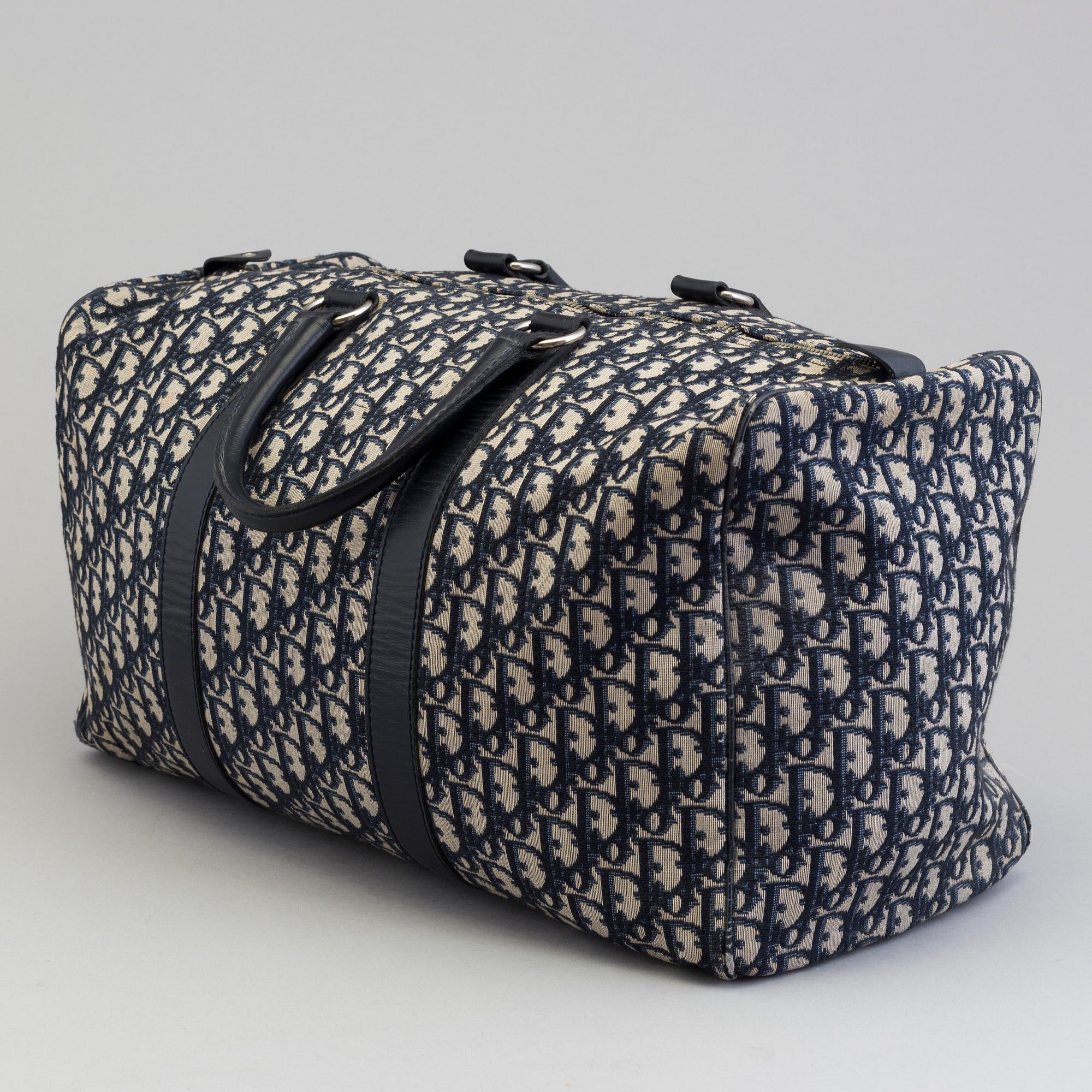 A Christian Dior 'Speedy' weekend bag.