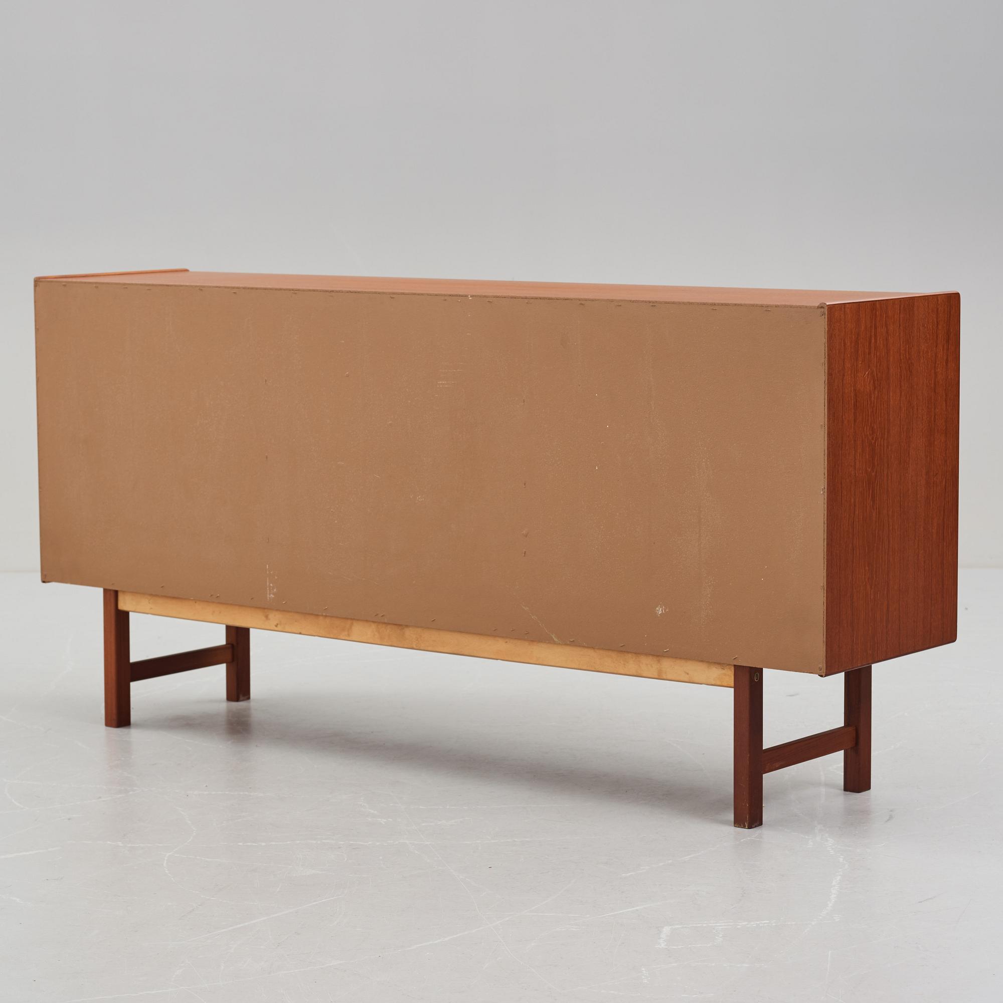 A late 20th Century teak veneered sideboard.
