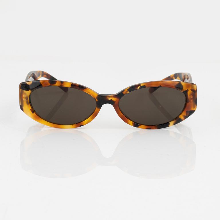 Gucci, a pair of gold tone logo sunglasses.