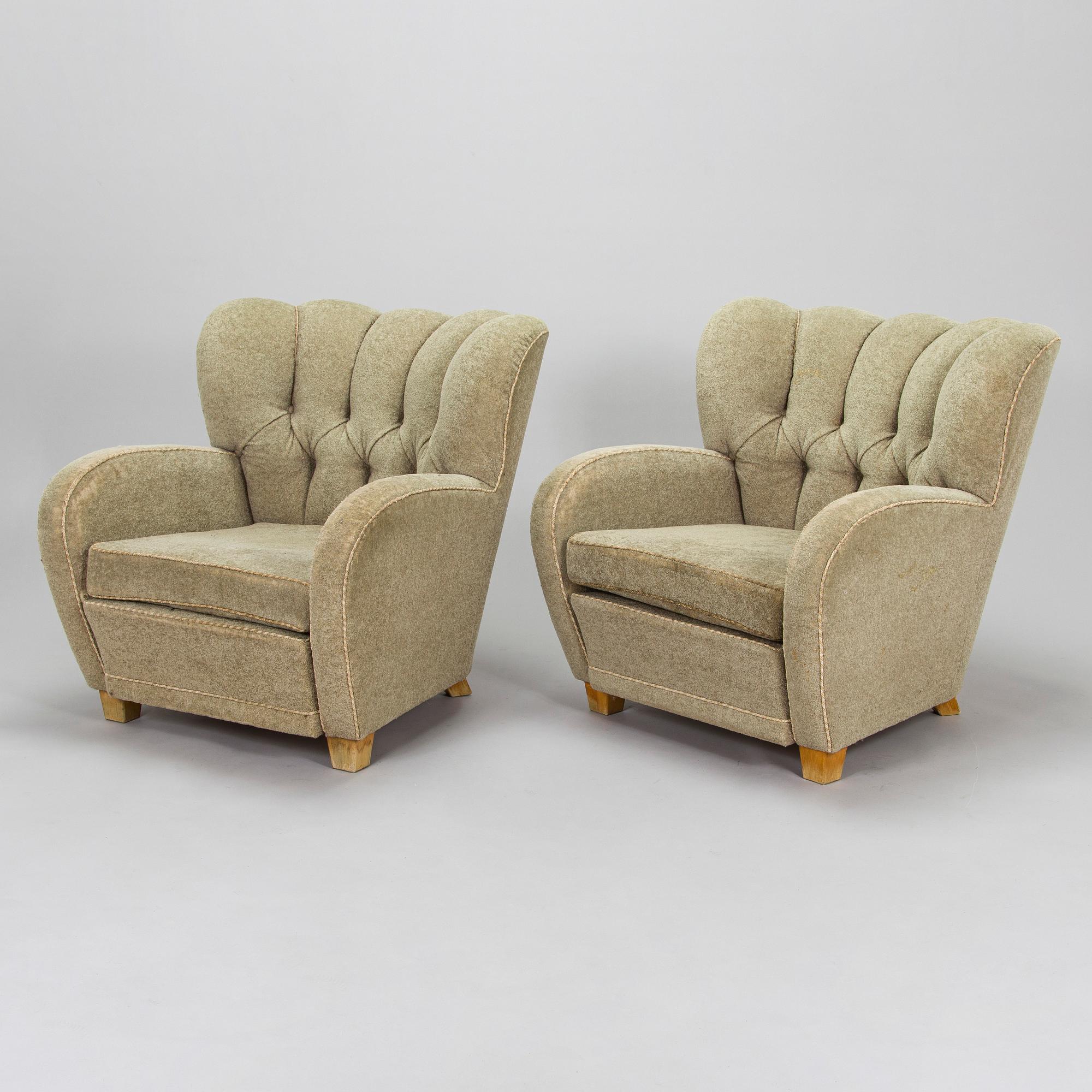 A pair of mid-20th century armchairs.
