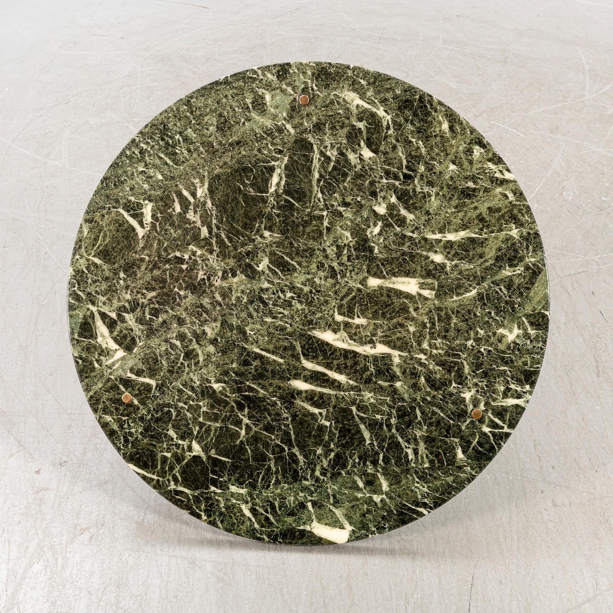A marble coffee table alter part of the 20th century.