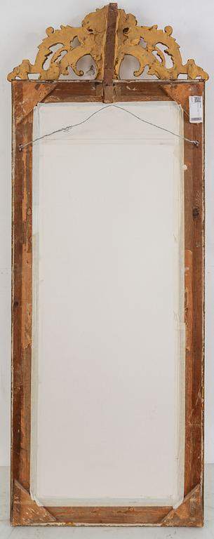 A second half of the 20th Century rococo style mirror with a console table.