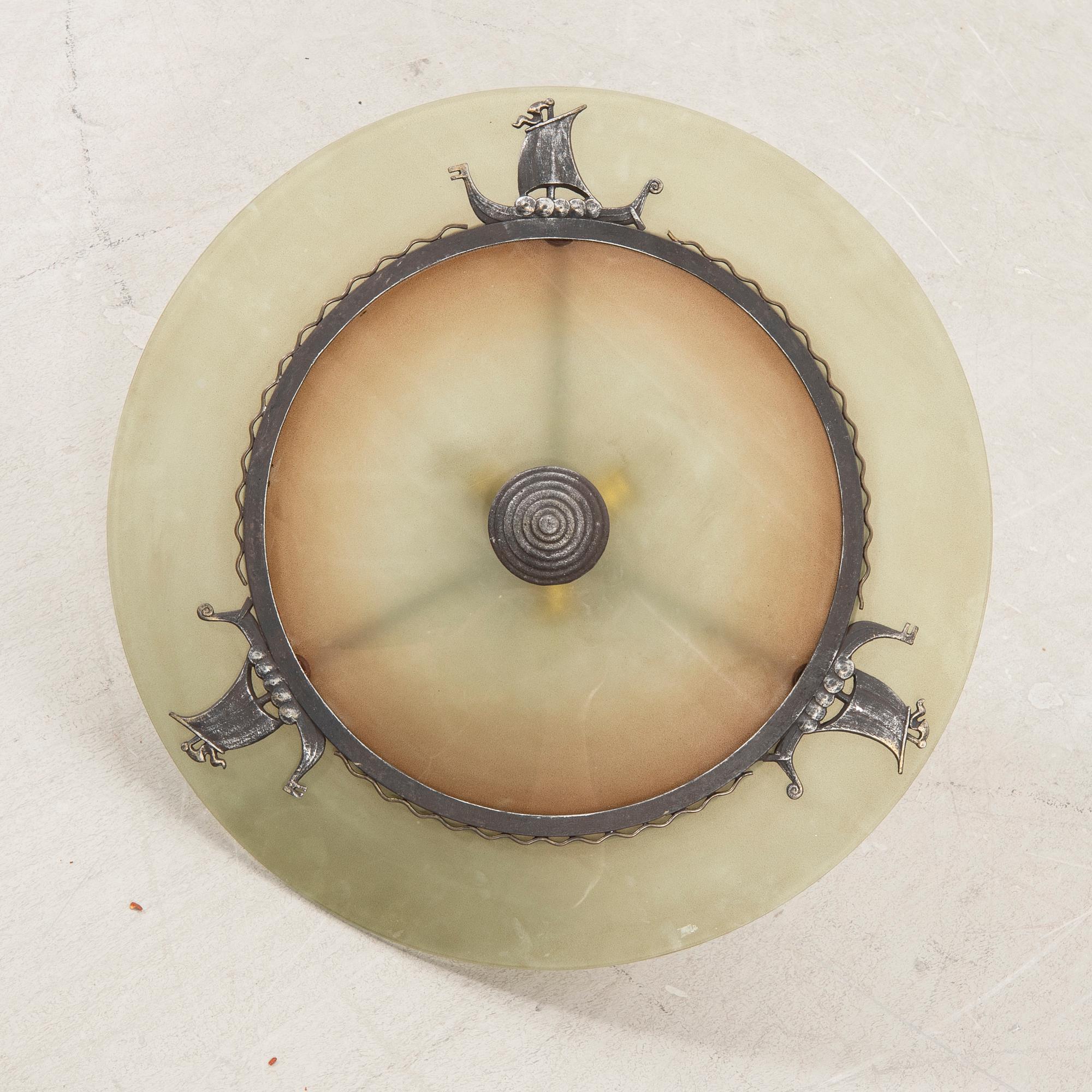 A 1930s glass ceiling pendant.