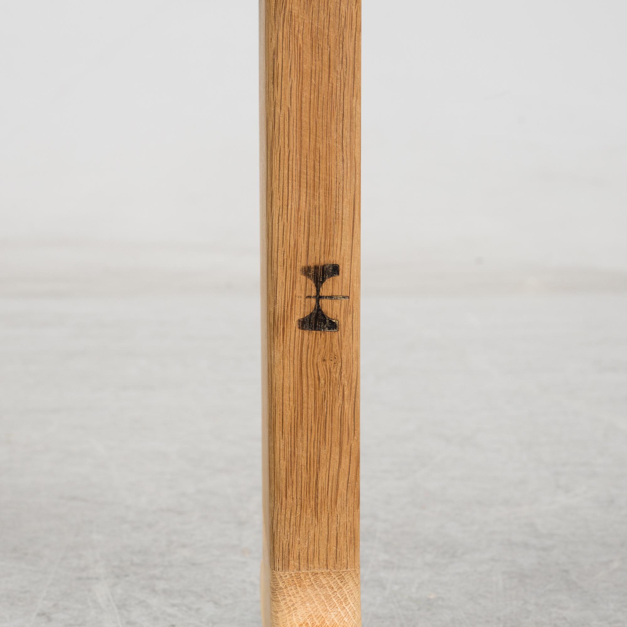 A model JH 575 coffee table by Hans J Wegner for Johannes Hansen.