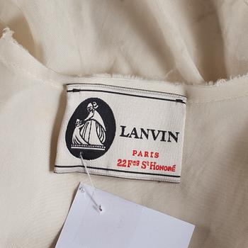 A white silk cocktail dress by Lanvin.