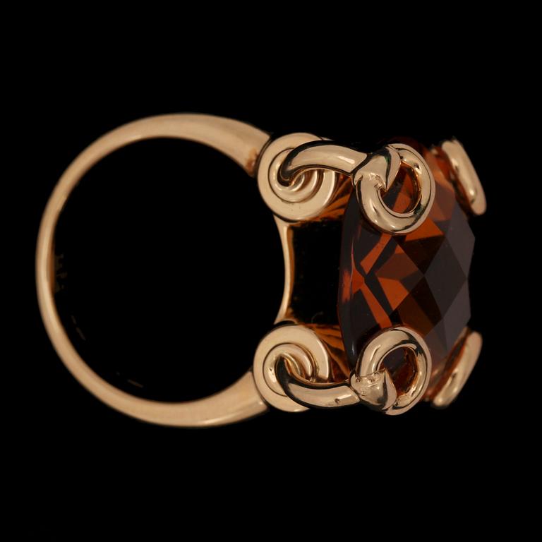 A Gucci ring with checker-cut citrine.