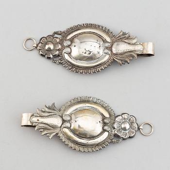 A pair of 19th century silver curtain tie-backs.
