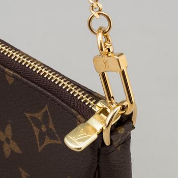 a LOUIS VUITTON small bag/pouch.