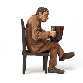 Axel Petersson Döderhultarn, Seated accordionist.