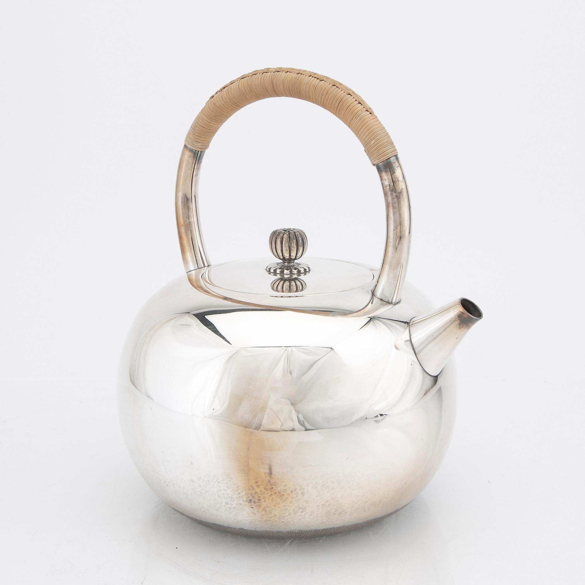 A Japanese early 20th century sterling silver tea pot.