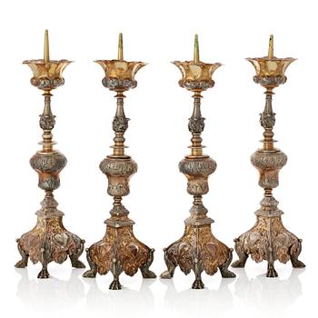 Four Italian 17th/18th century silver-gilt candlesticks, unidentfied makers mark ZP, Venice.