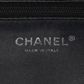 CHANEL, a black leather shoulder bag.
