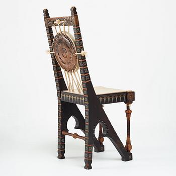 Carlo Bugatti, CARLO BUGATTI, an ebonized wood and walnut chair, Turin, Italy ca 1900.
